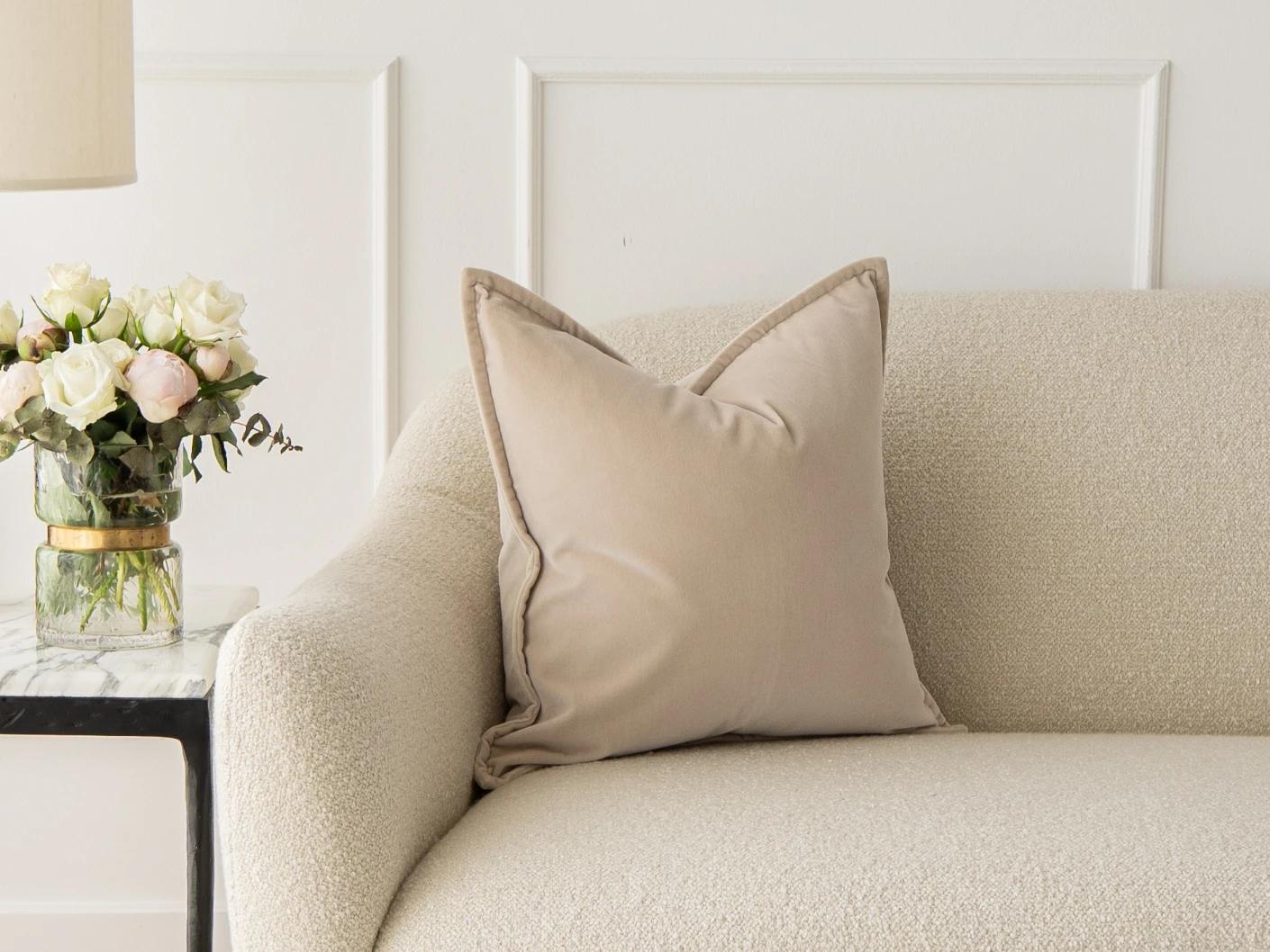 Alessandra River cushion in beige, shown in a lifestyle front view as image 1