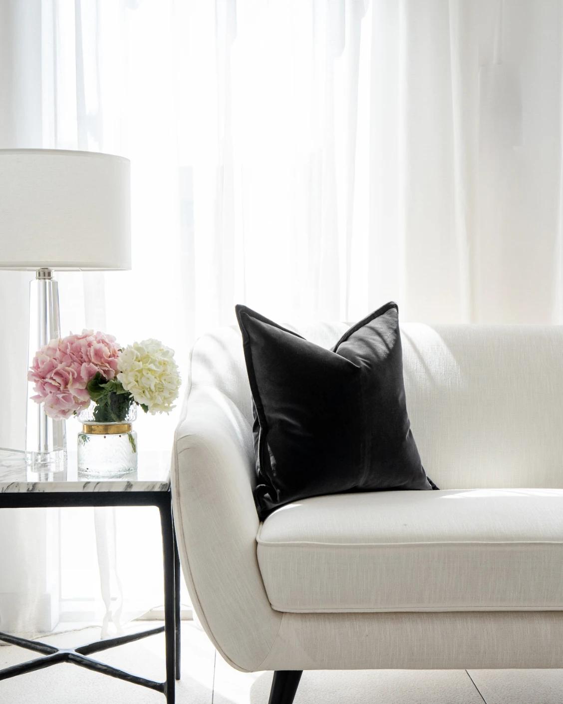 Alessandra Steele cushion in charcoal and grey, shown in a lifestyle front view as image 5