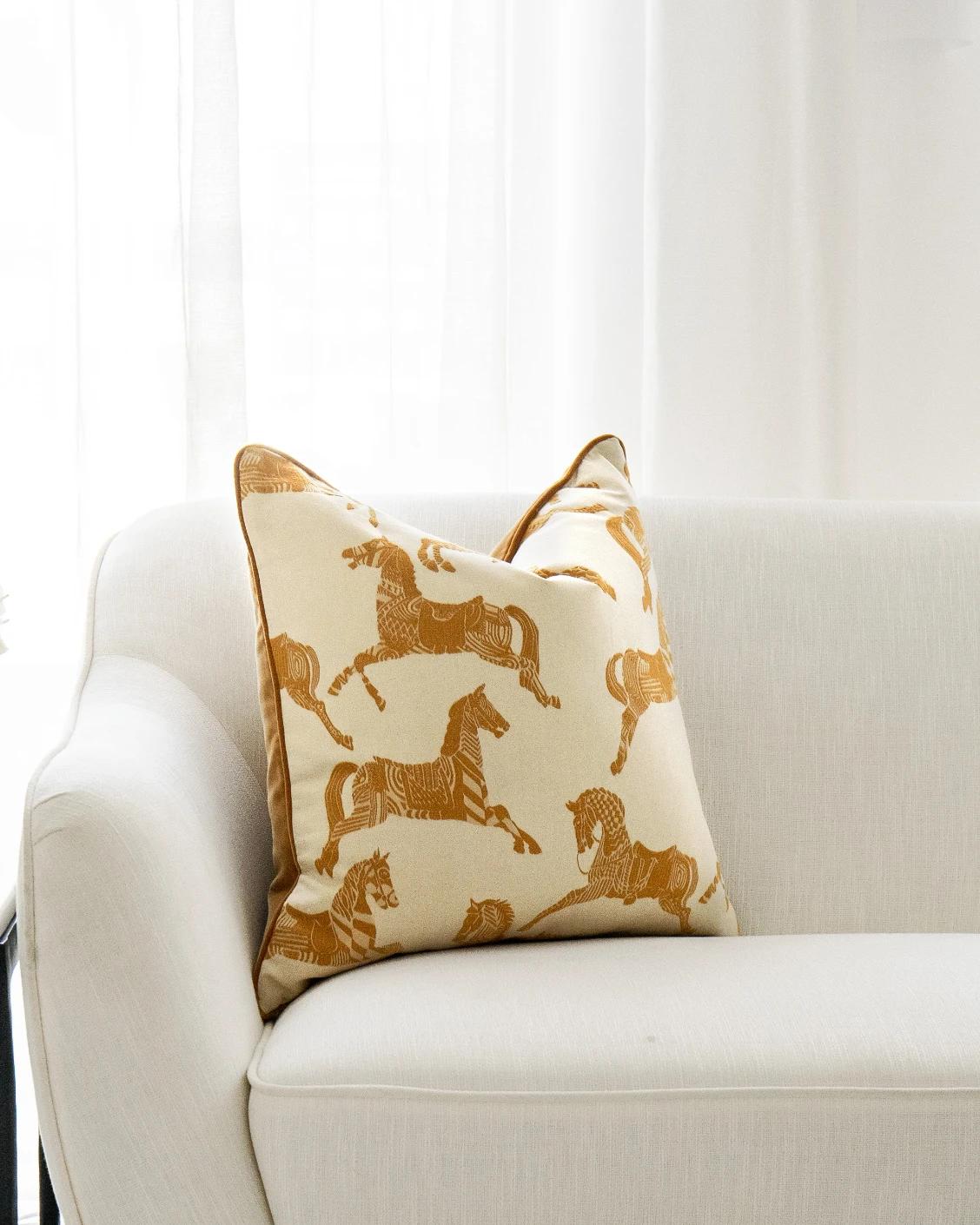 Aurora Klimt cushion in orange and beige, shown in a lifestyle front view as image 4