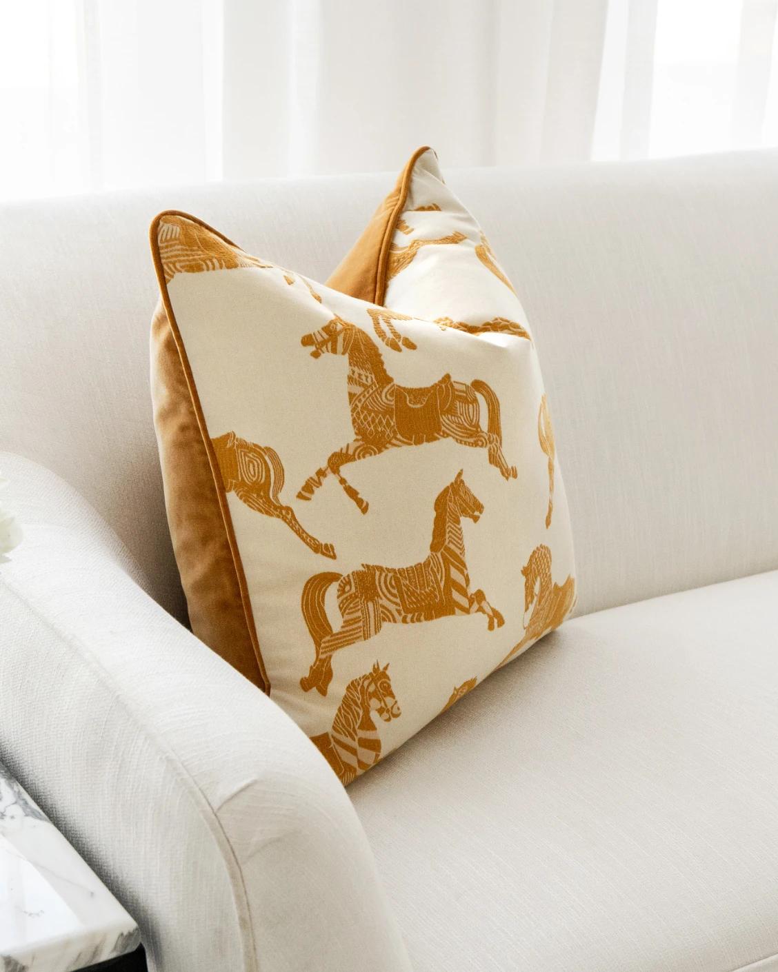 Aurora Klimt cushion in orange and beige, shown in a lifestyle left view as image 5