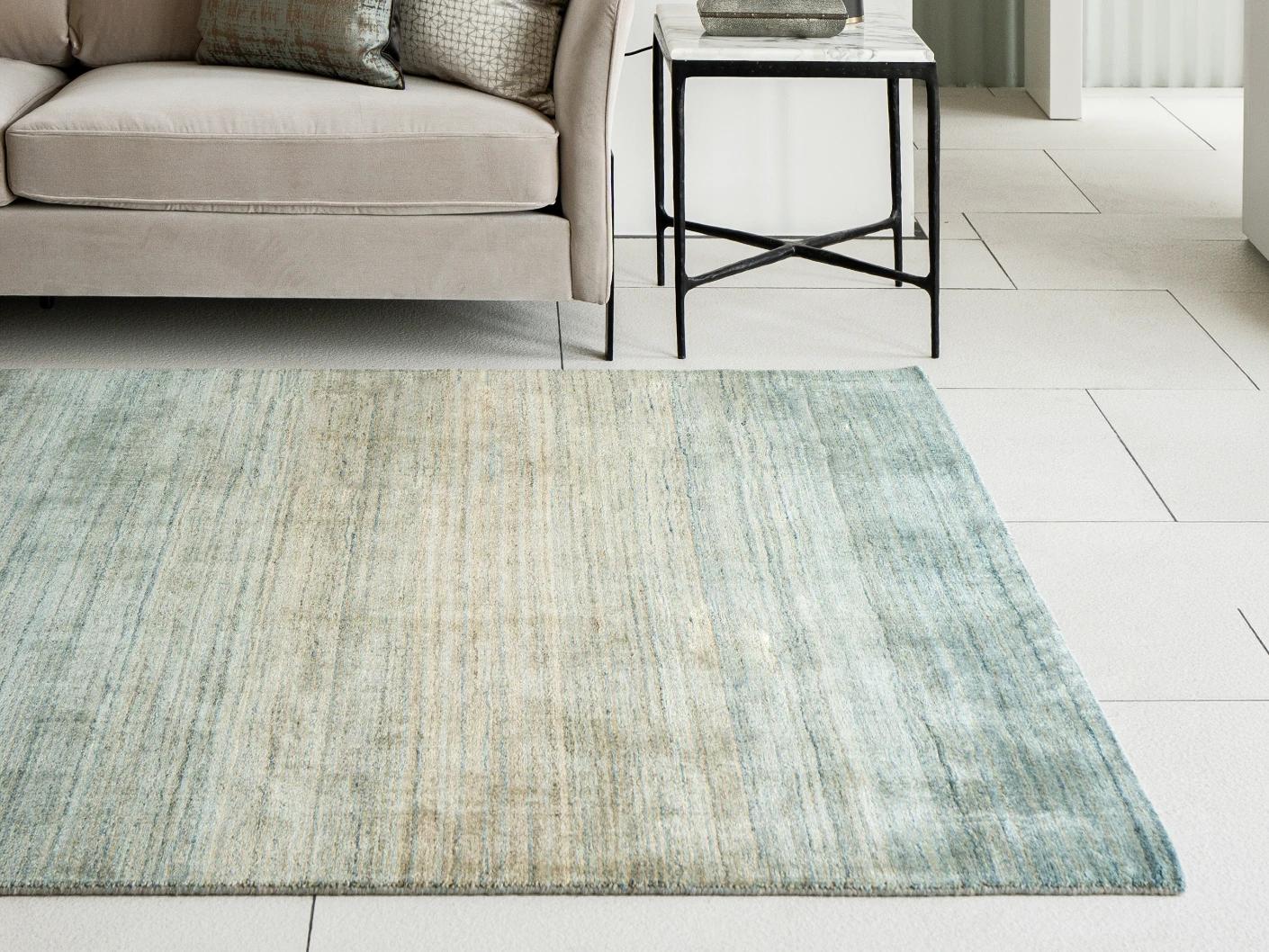 Ava Sandy carpets in turquoise and beige, shown in a lifestyle right view as image 2