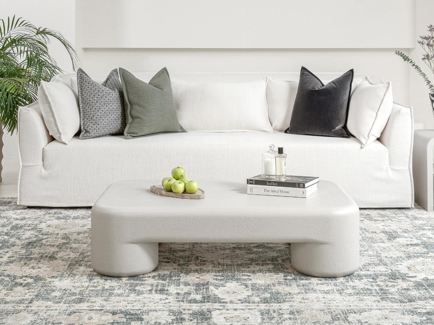 Bari coffee table in soft ivory and stone, shown in a lifestyle front view as image 5