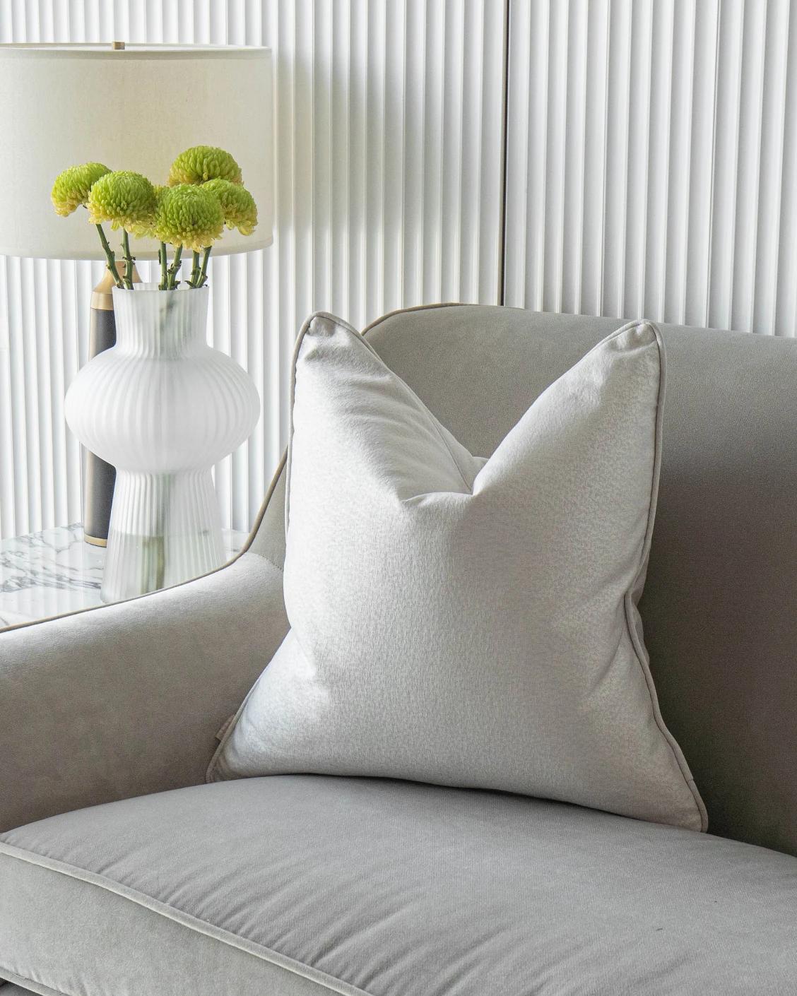 Celeste Hodler cushion in silver, shown in a lifestyle front view as image 2