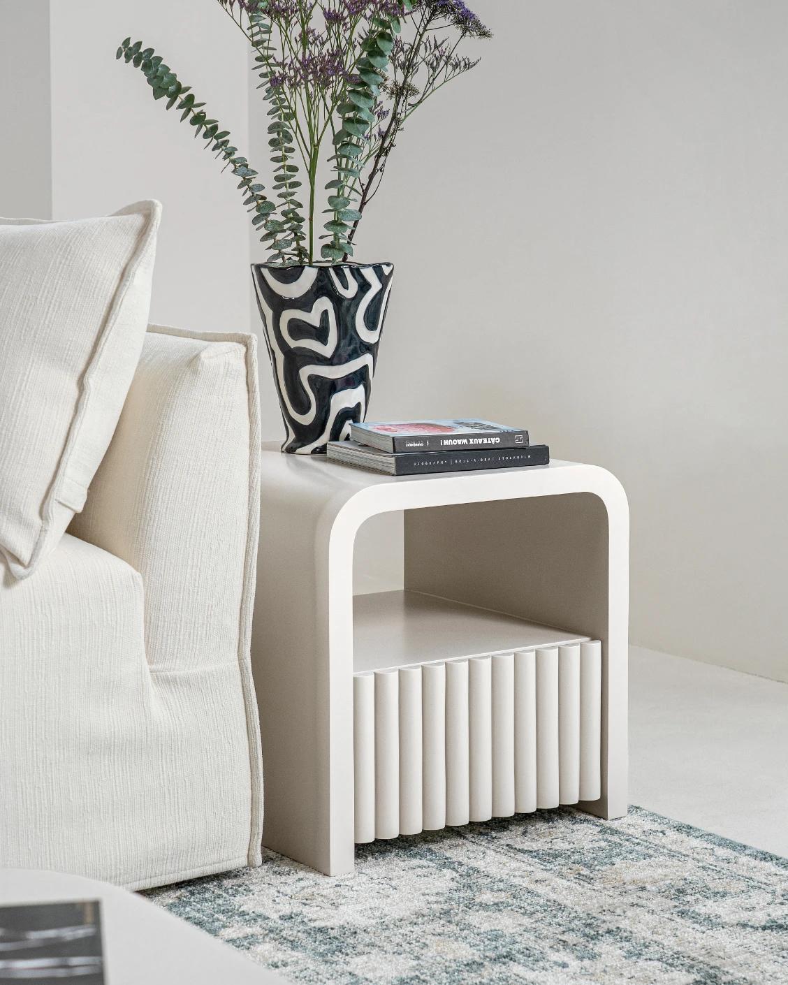 Celia nightstand in soft ivory and stone, shown in a lifestyle left view as image 4