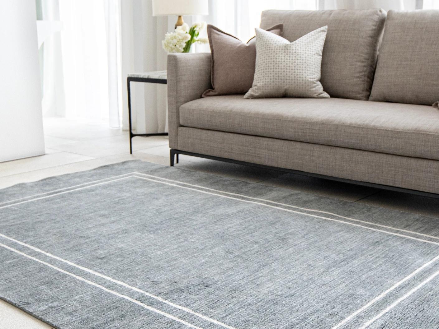 Colin Ashton carpet in blue and white, shown in a lifestyle right view as image 6