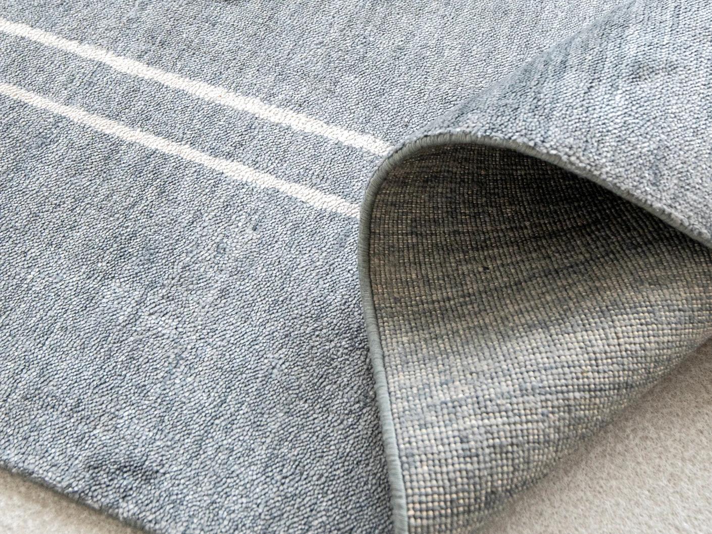 Colin Ashton carpet in blue and white, shown in a product close-up as image 9