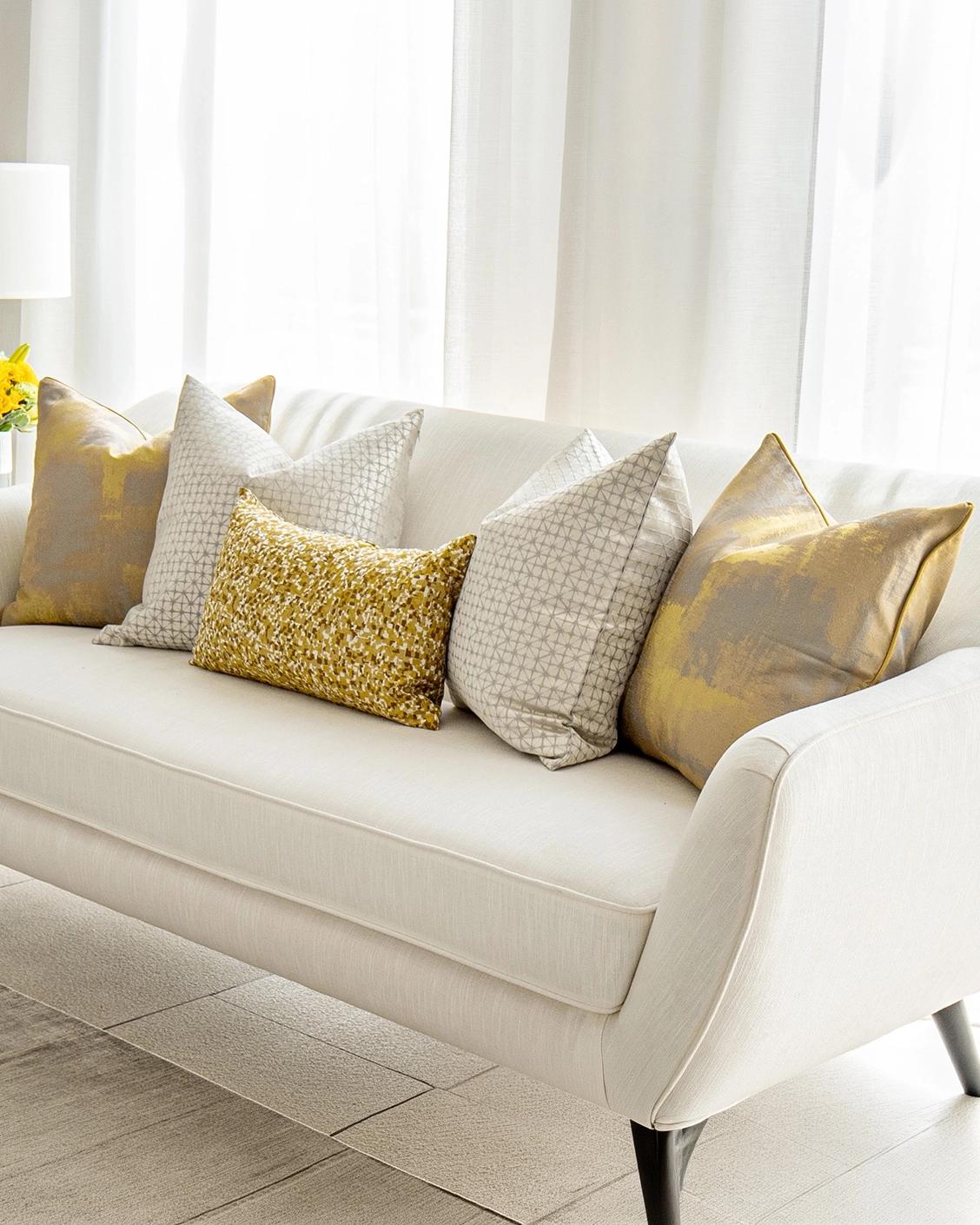 Ivan Bundle cushion in gold and silver, shown in a product right view as image 2