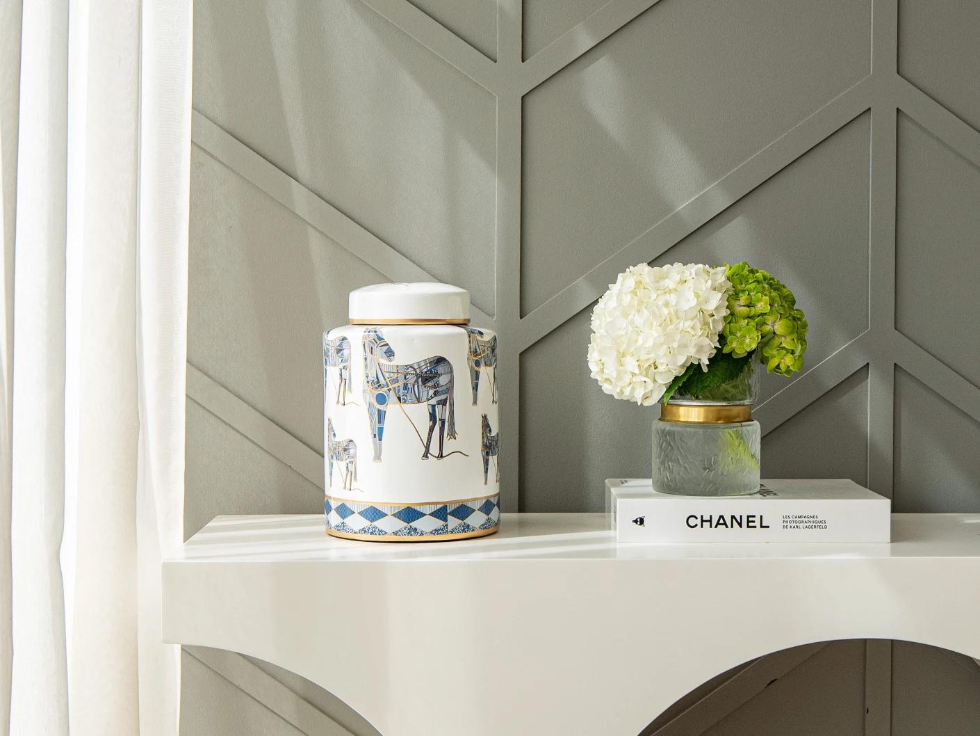 Eloisa Arneson II jars in white and blue, shown in a lifestyle front view as image 3