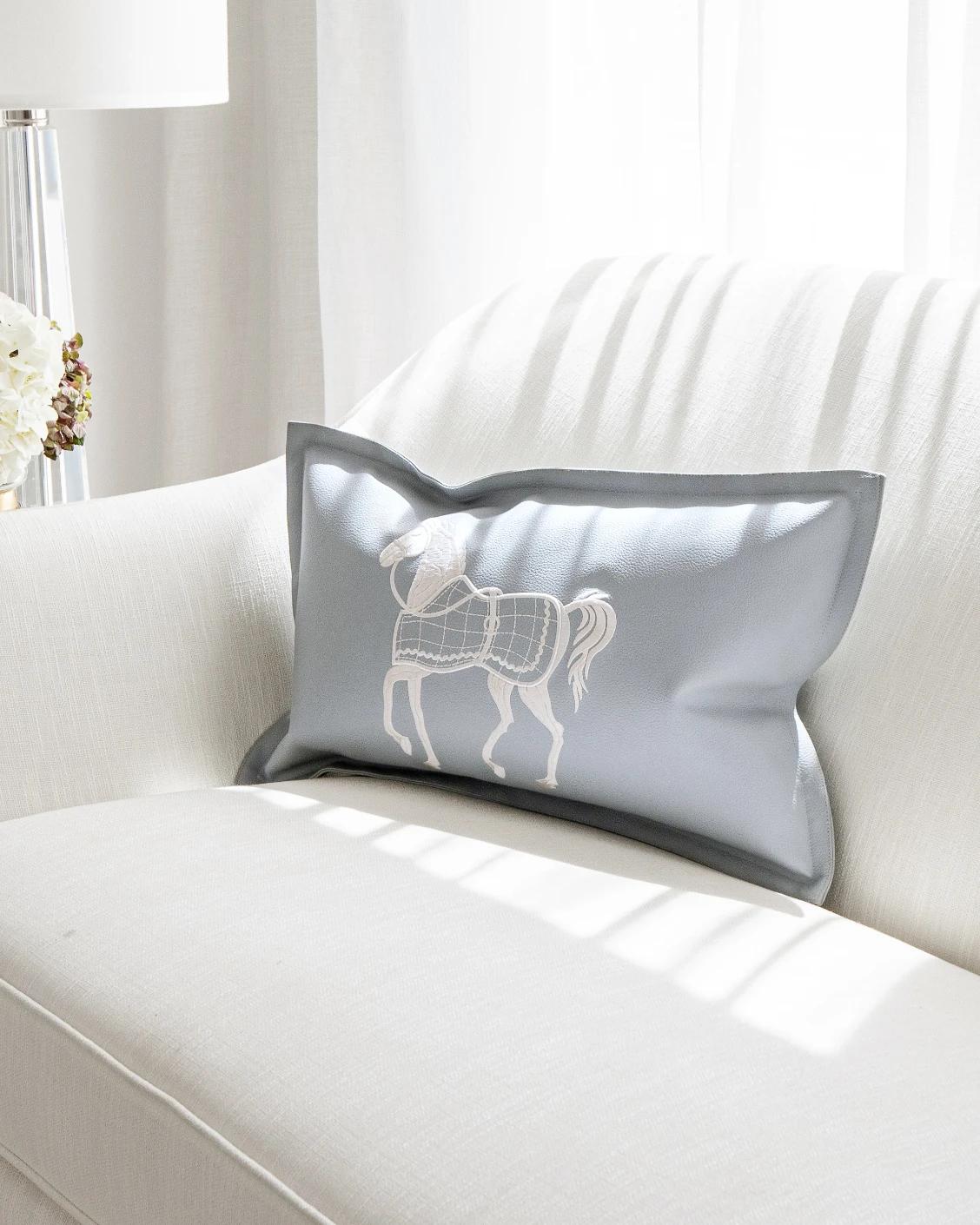 Filip Matisse cushion in blue and white, shown in a lifestyle front view as image 2