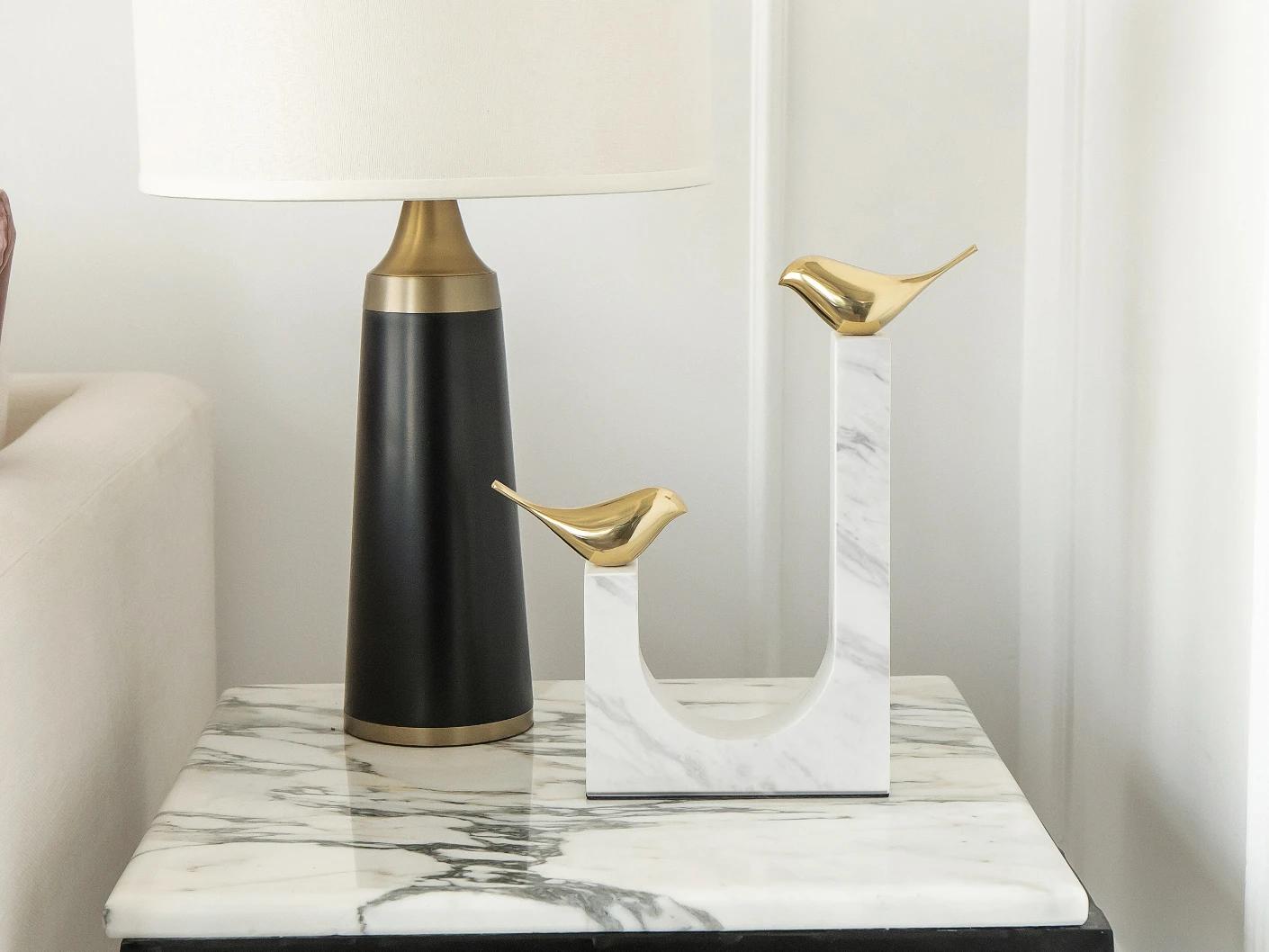 Finch Butterfield statues and sculptures in white and gold, shown in a lifestyle front view as image 1