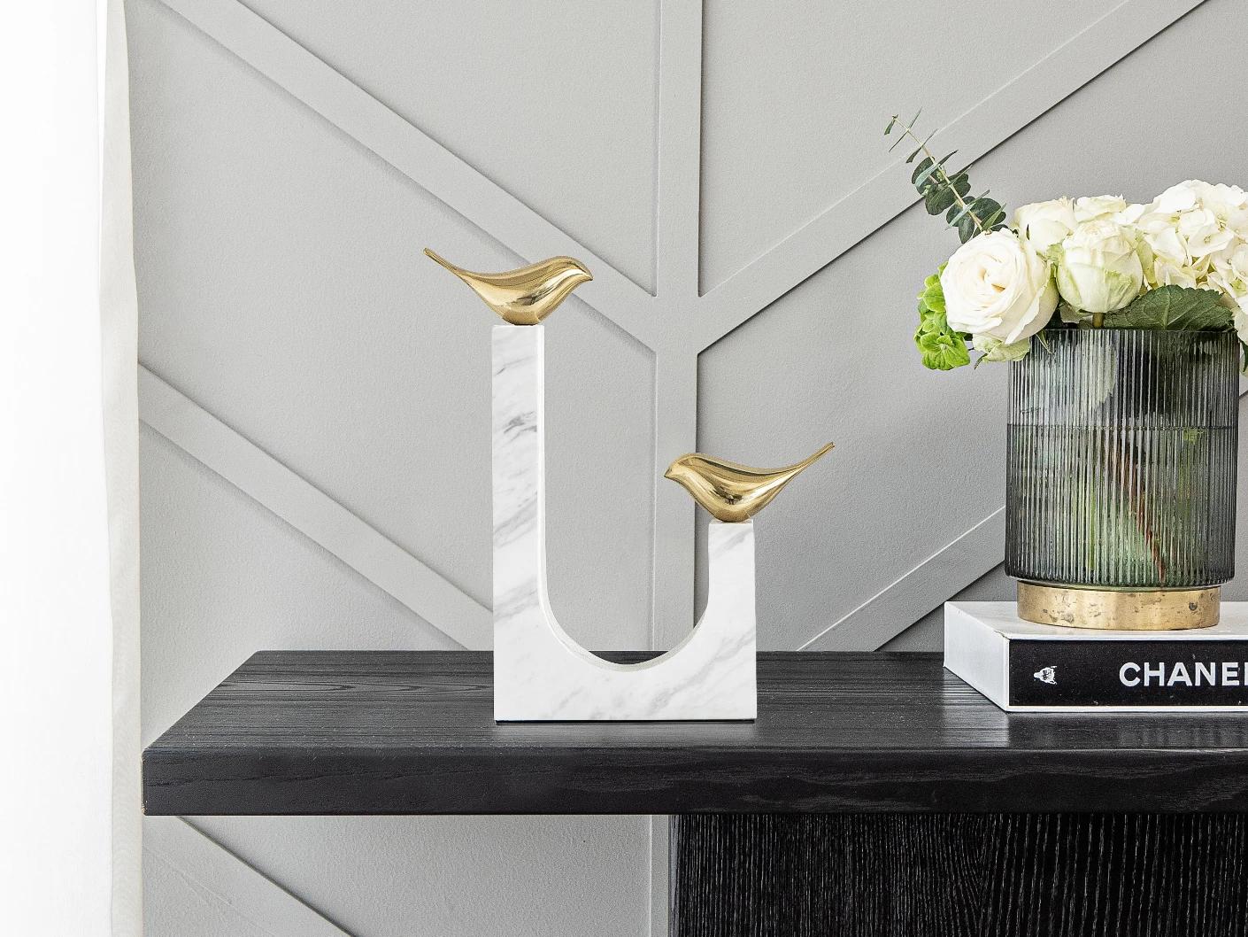 Finch Butterfield statues and sculptures in white and gold, shown in a lifestyle front view as image 2