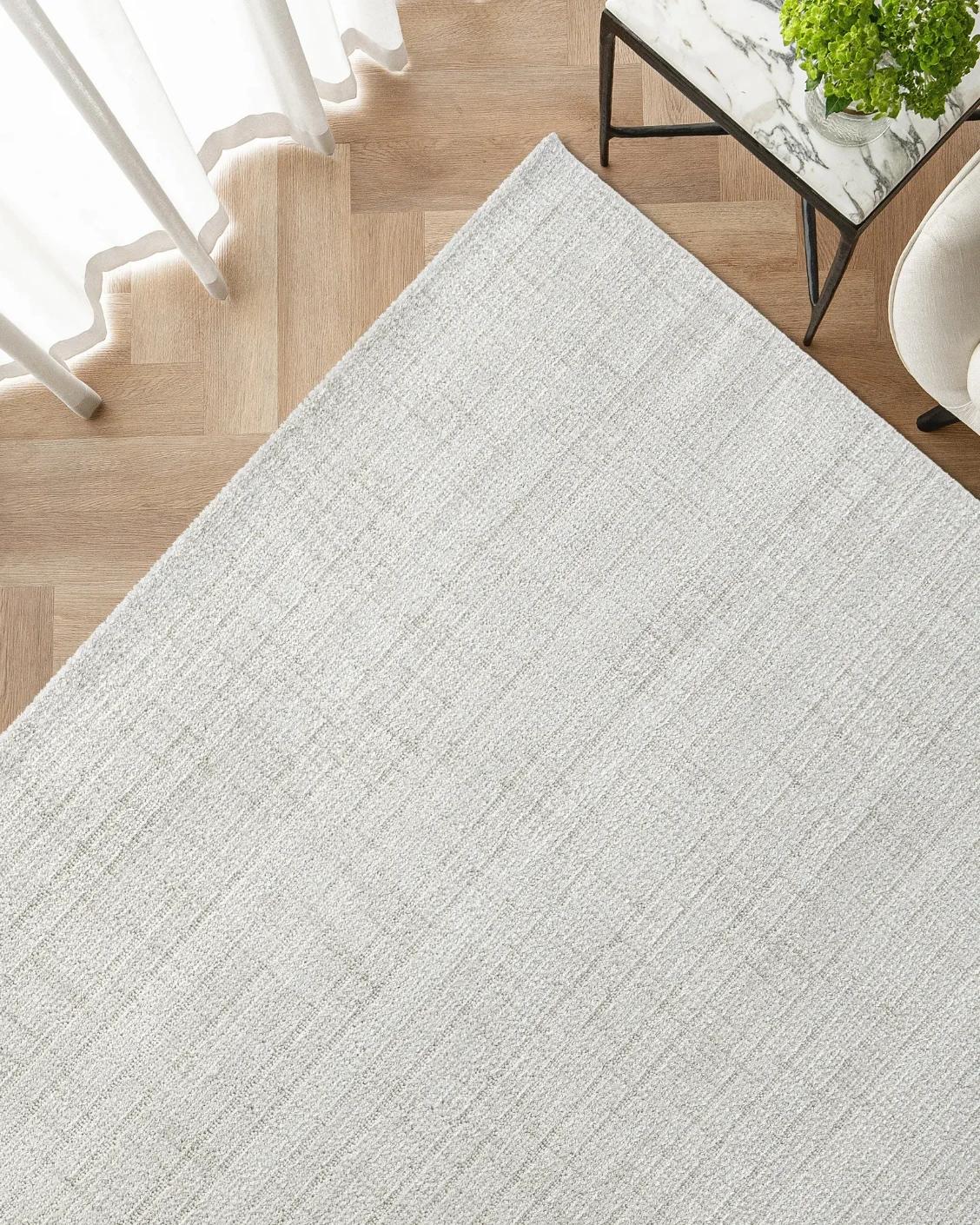 Henry Bianca carpet in ivory and pearl, shown in a lifestyle top view as image 2