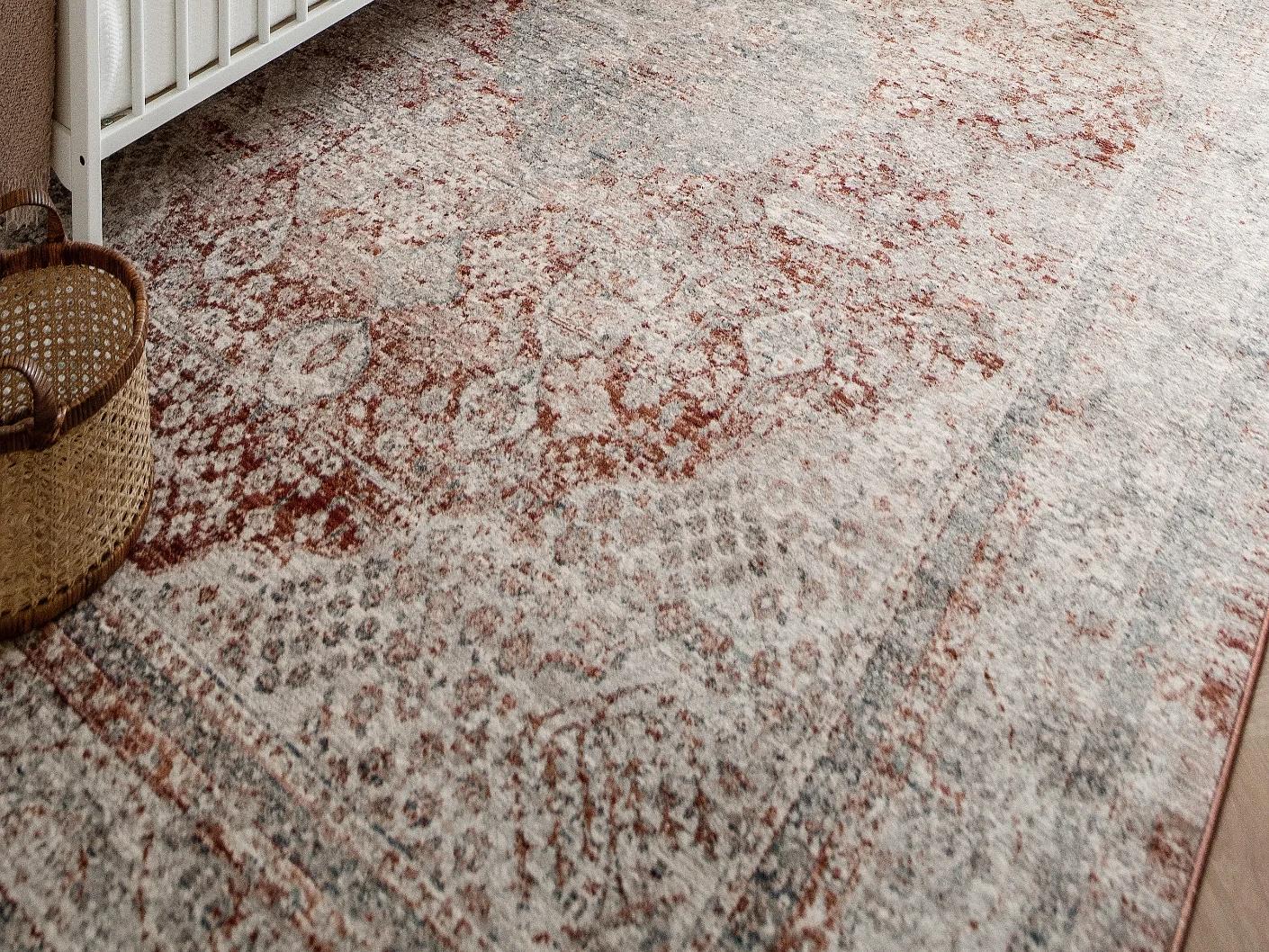 Alexander Rosso carpets in red and beige, shown in a lifestyle close-up as image 1