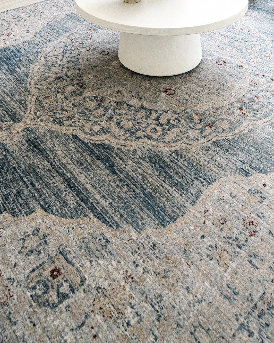 Alexander Sky carpet in pale blue, blue and beige, shown in a lifestyle close-up as image 4