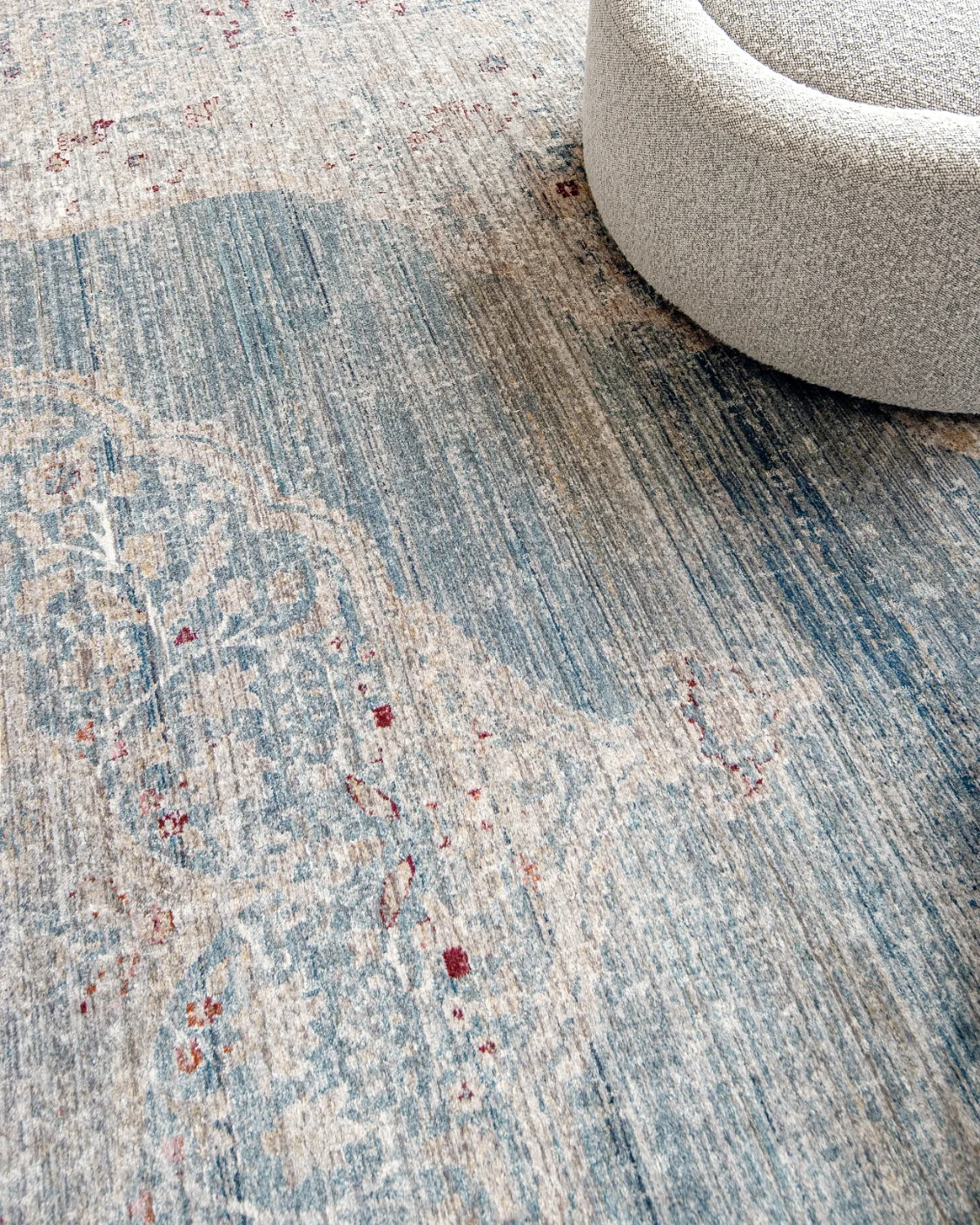 Alexander Sky carpet in pale blue, blue and beige, shown in a lifestyle close-up as image 5
