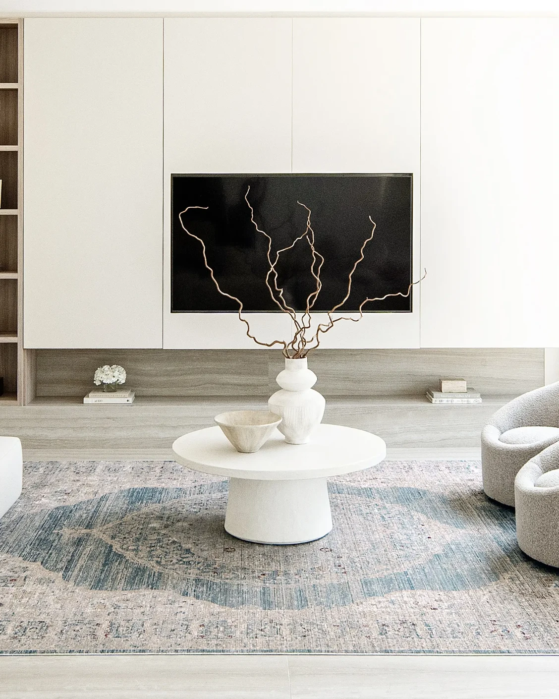 Alexander Sky carpet in pale blue, blue and beige, shown in a lifestyle front view as image 6