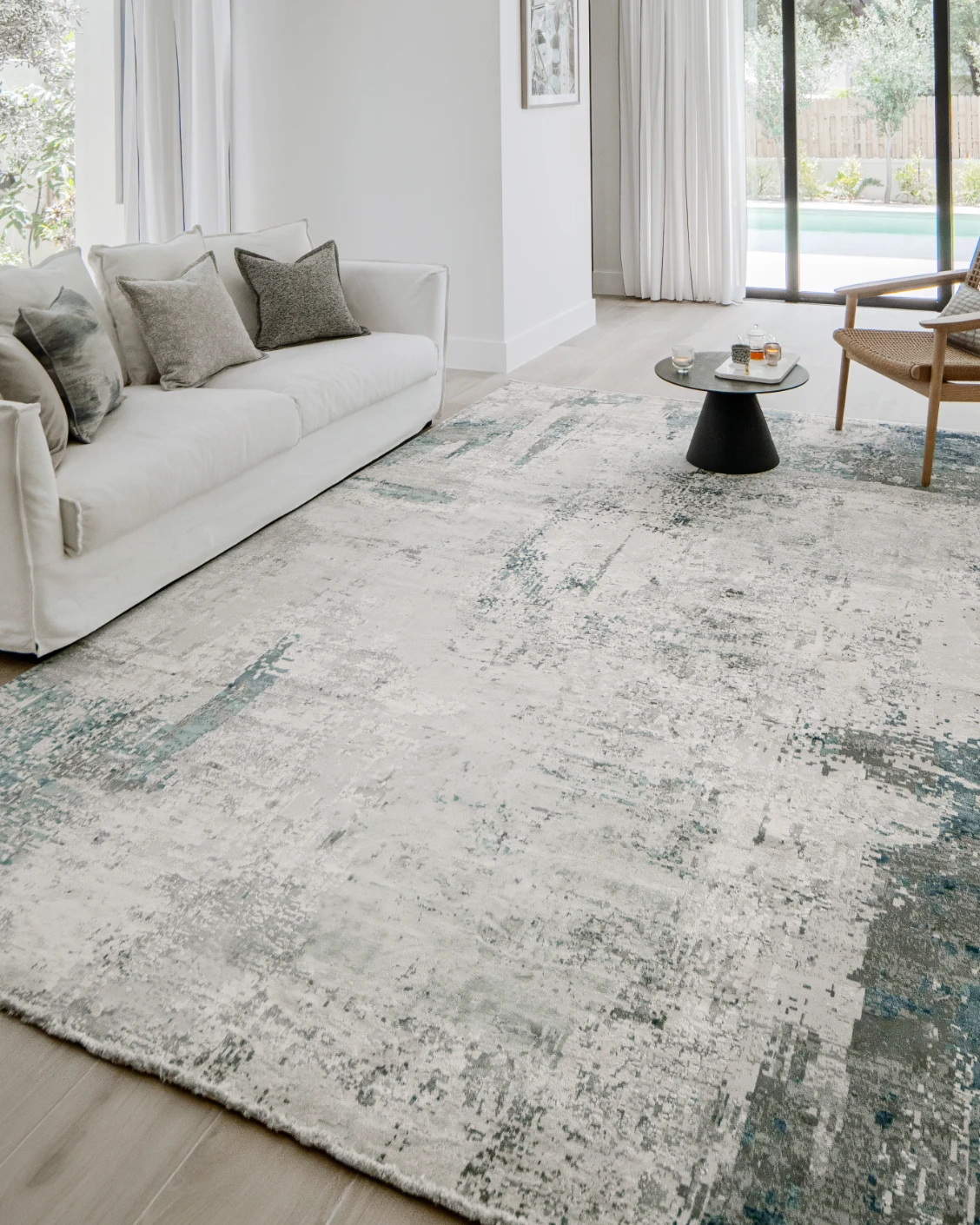 Athena Sky carpet in sky, blue and grey, shown in a lifestyle left view as image 7