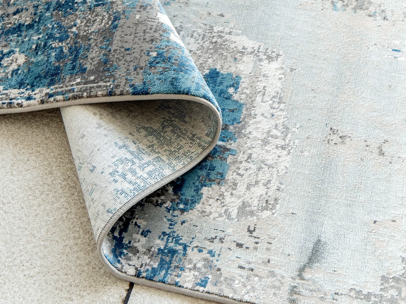 Athena Sky carpets in sky, blue and grey, shown in a product close-up top view