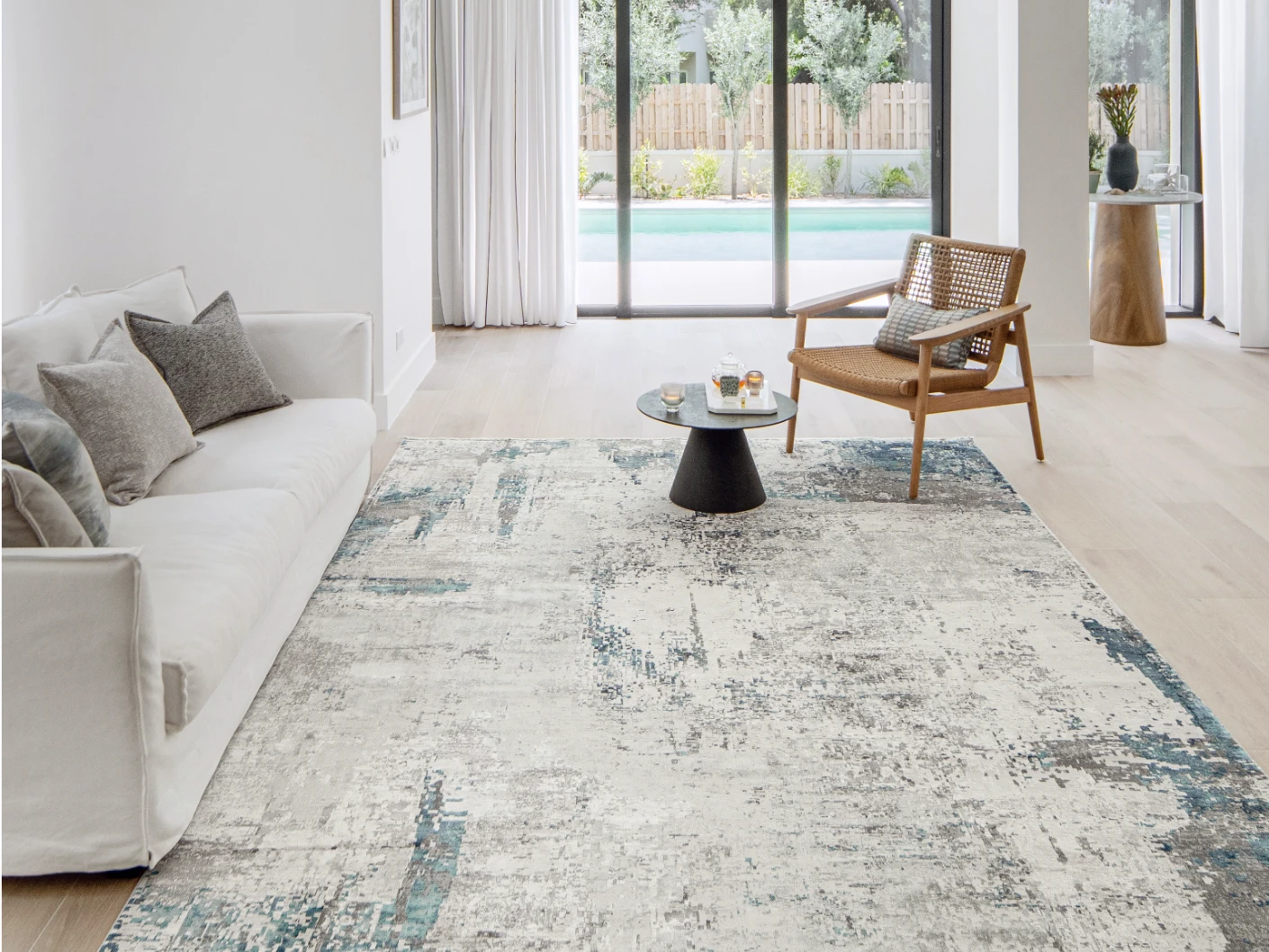 Athena Sky carpet in sky, blue and grey, shown in a lifestyle front view