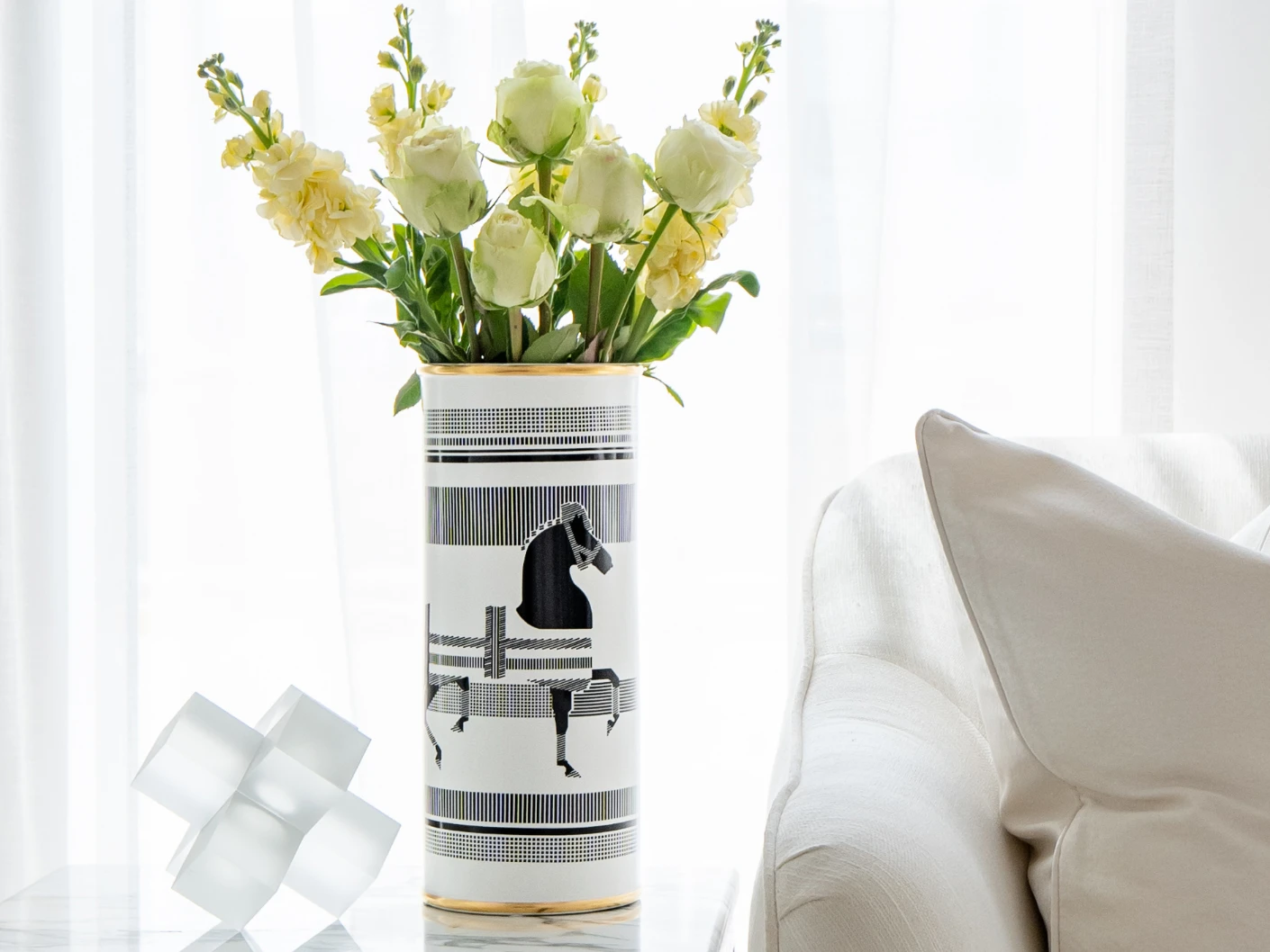 Aurora Arneson vases in white and black, shown in a lifestyle front view