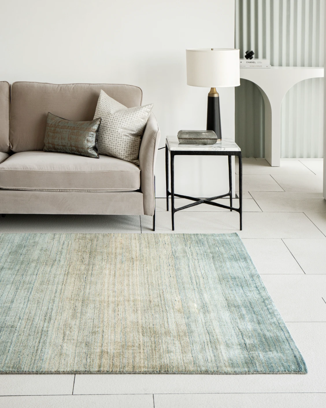 Ava Sandy carpets in turquoise and beige, shown in a lifestyle right view as image 2