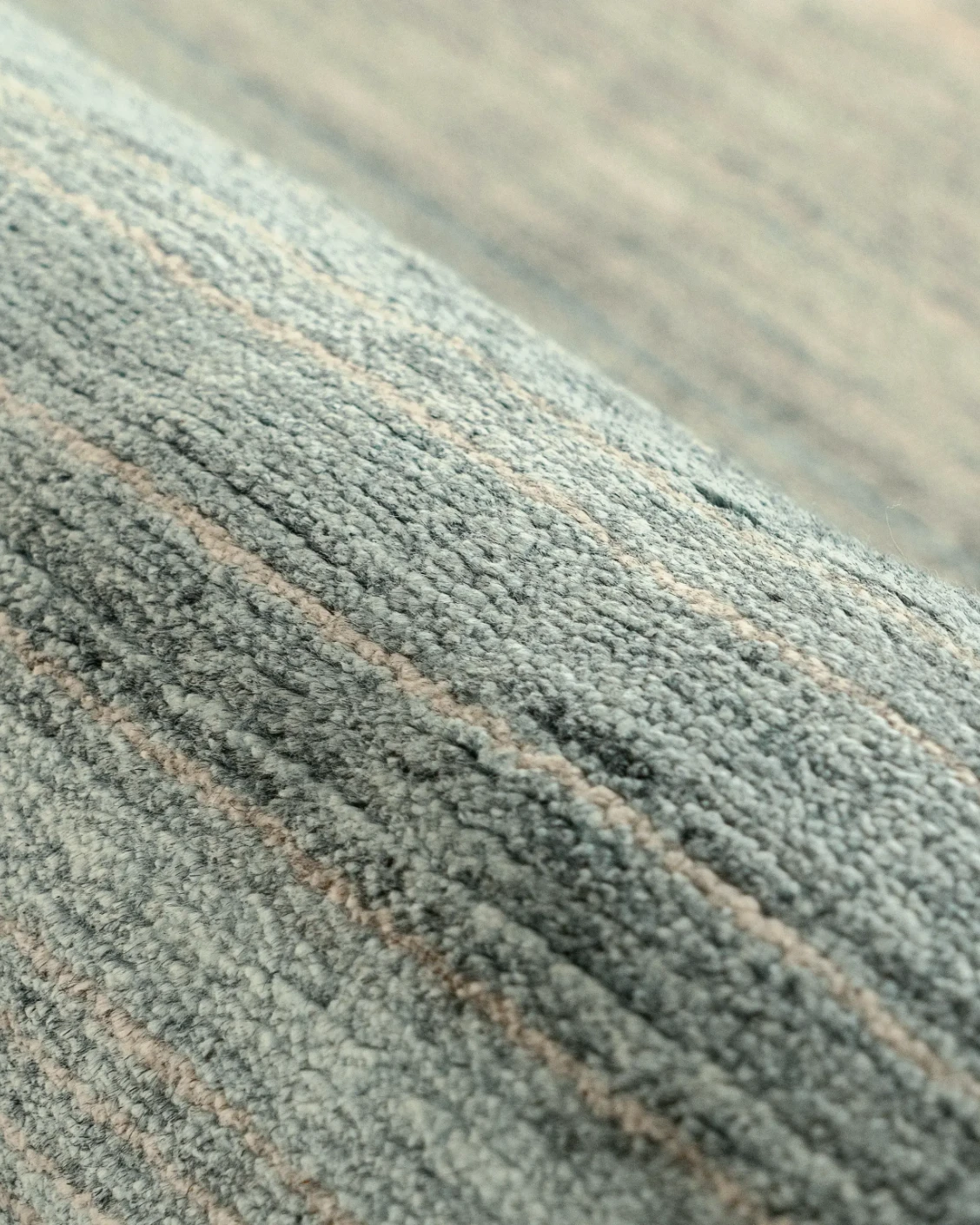 Ava Sandy carpet in sandy, turquoise and beige, shown in a product close-up as image 7