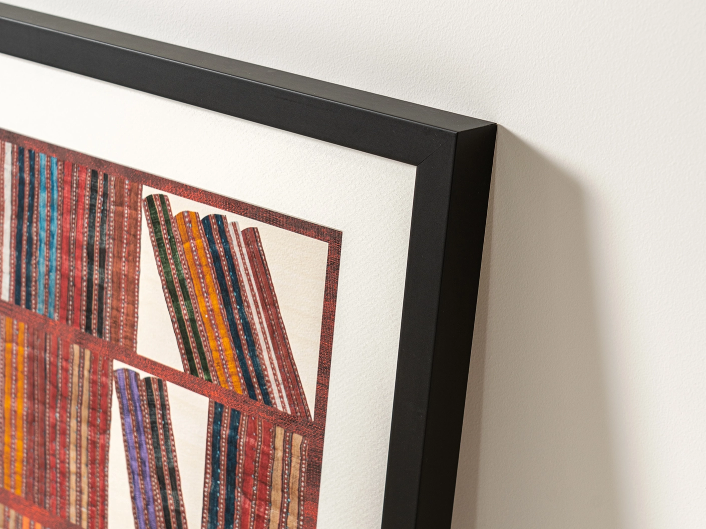 Books fine art print in rust, blue and multicolour, shown in a lifestyle left view as image 2
