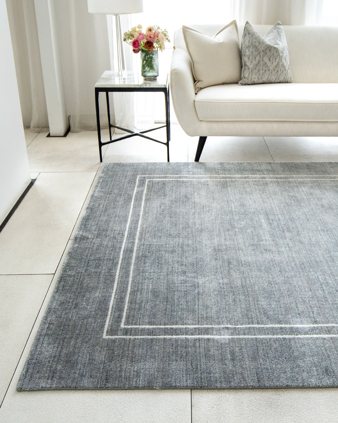 Colin Ashton carpets in blue and white, shown in a lifestyle front view as image 2