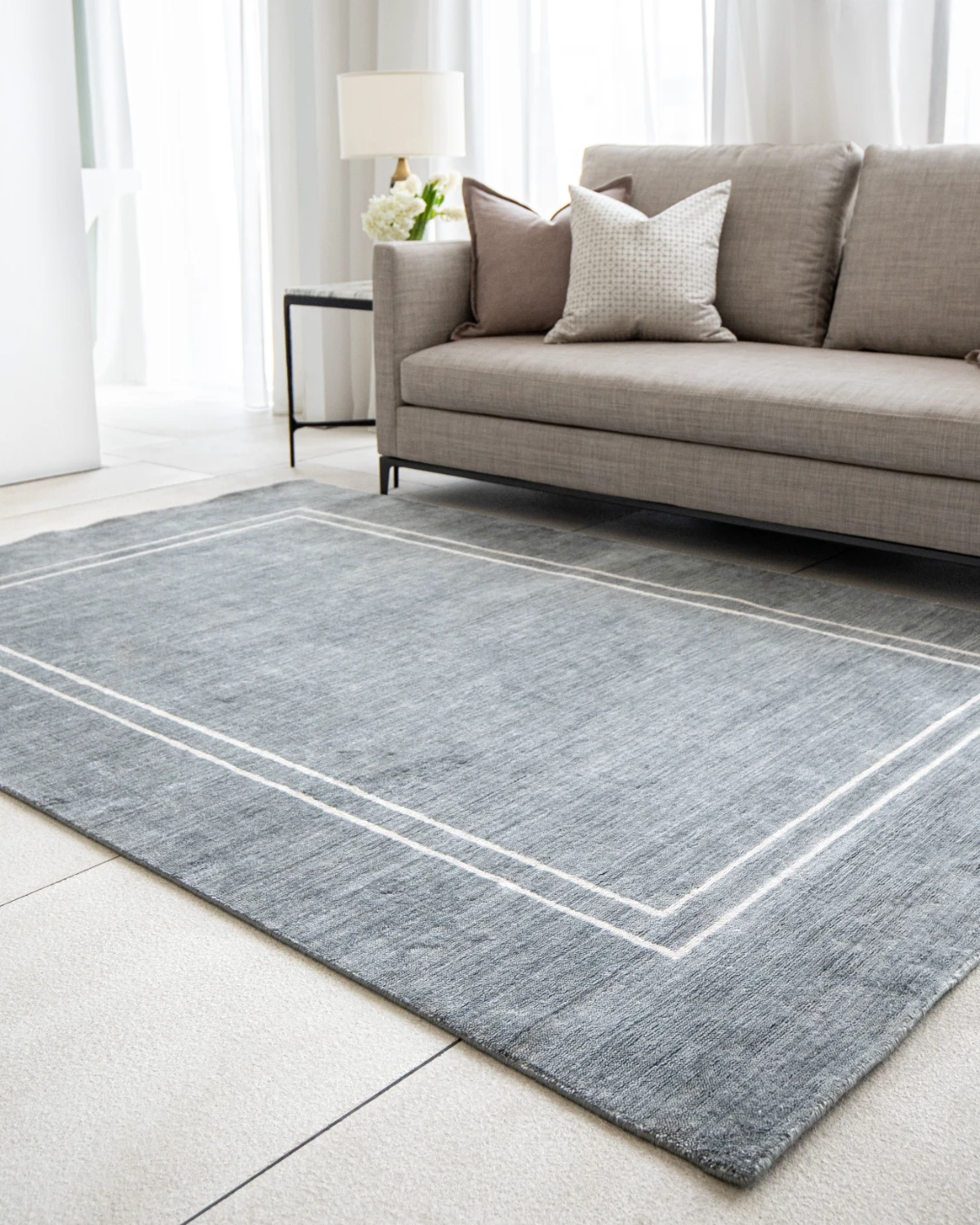 Colin Ashton carpet in blue and white, shown in a lifestyle right view as image 6