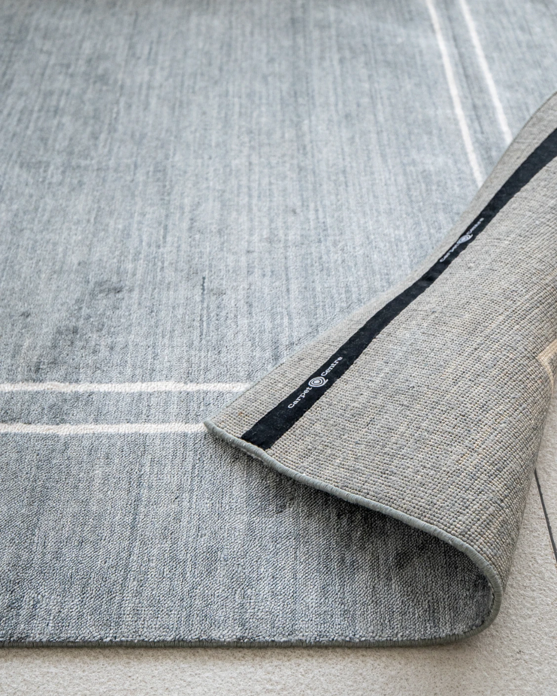 Colin Ashton carpet in blue and white, shown in a product close-up as image 8