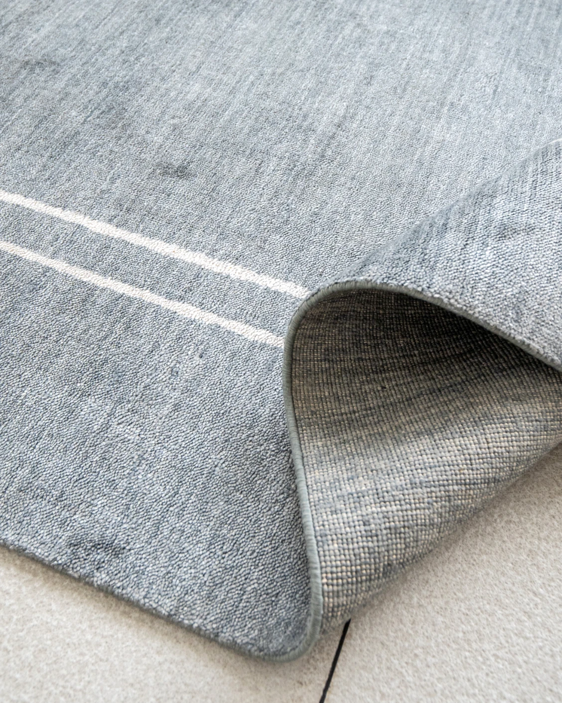 Colin Ashton carpet in blue and white, shown in a product close-up as image 9
