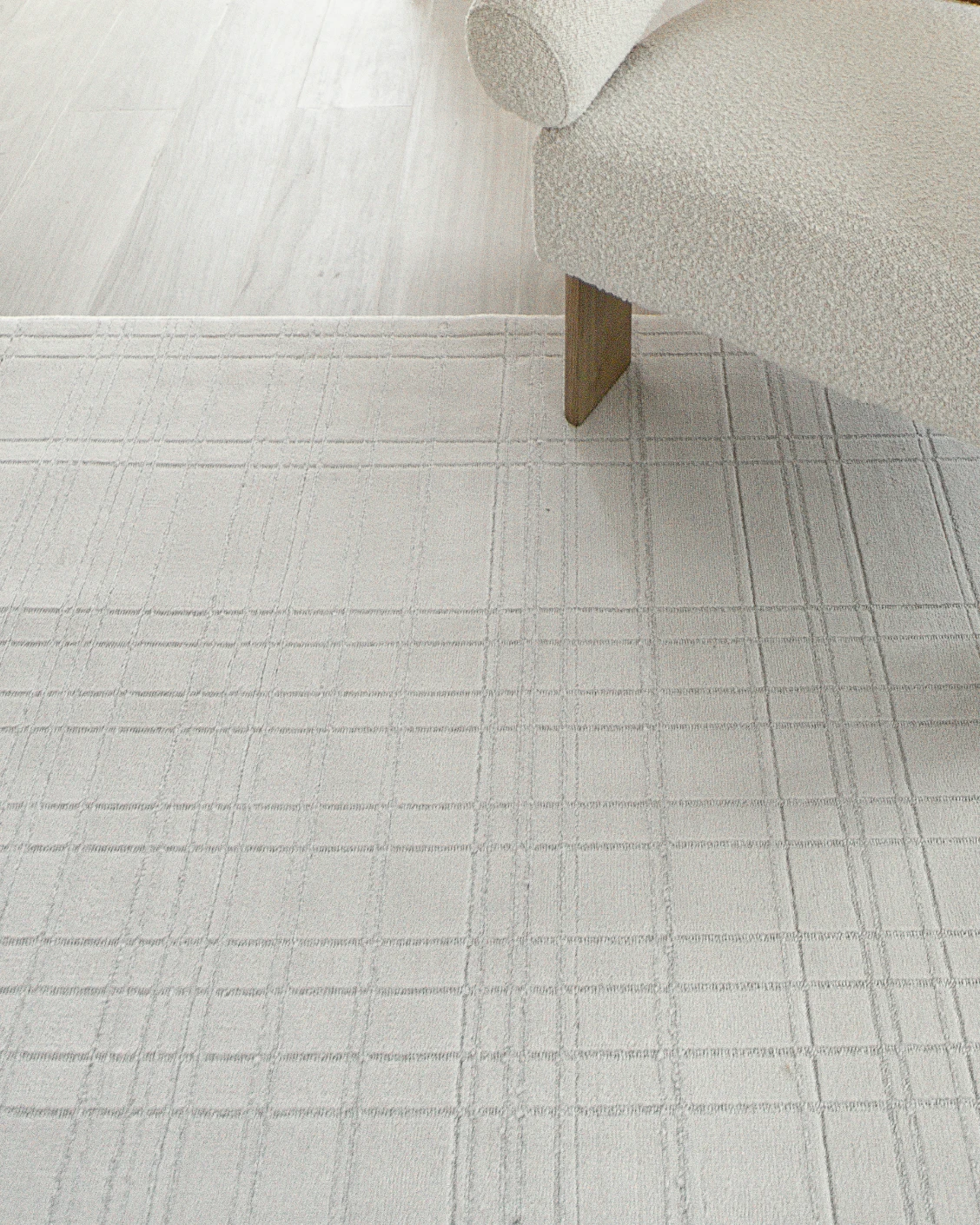 Corvin Sandy carpet in ivory and grey, shown in a lifestyle close-up as image 5