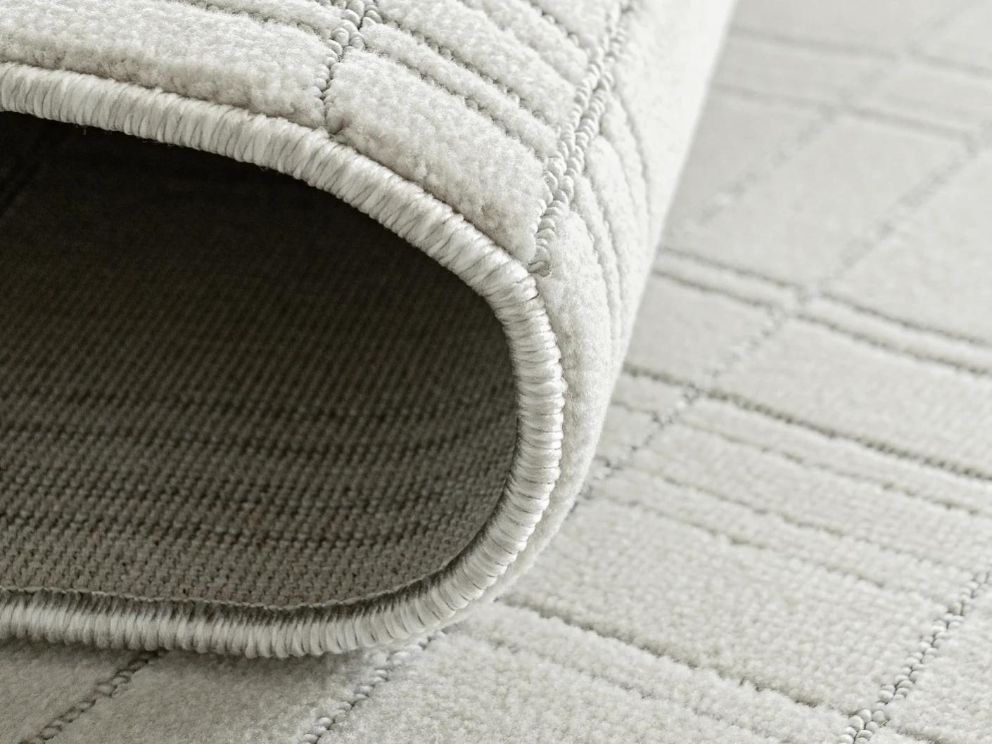 Corvin Sandy carpet in ivory and grey, shown in a product close-up as image 11