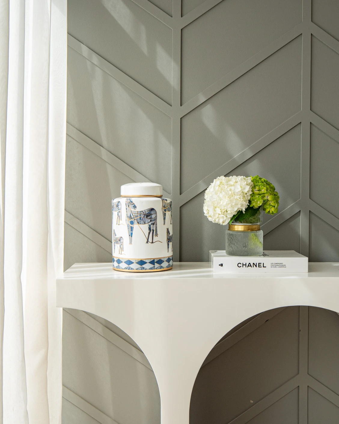 Eloisa Arneson II jars in white and blue, shown in a lifestyle front view as image 4