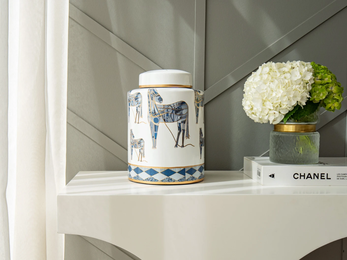 Eloisa Arneson jars in white and blue, shown in a lifestyle front view