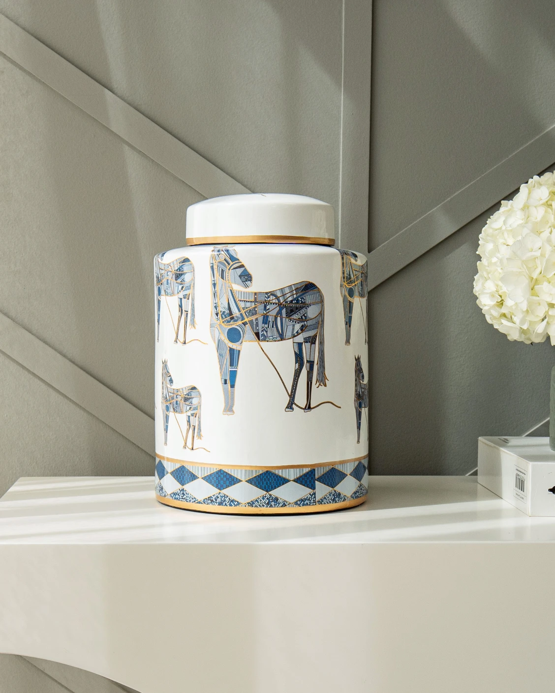 Eloisa Arneson II jars in white and blue, shown in a lifestyle front view as image 6
