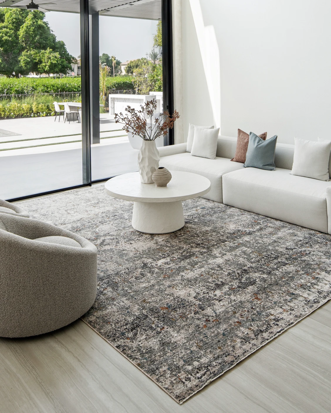 Ethan Ashton carpet in grey and beige, shown in a lifestyle front view as image 4