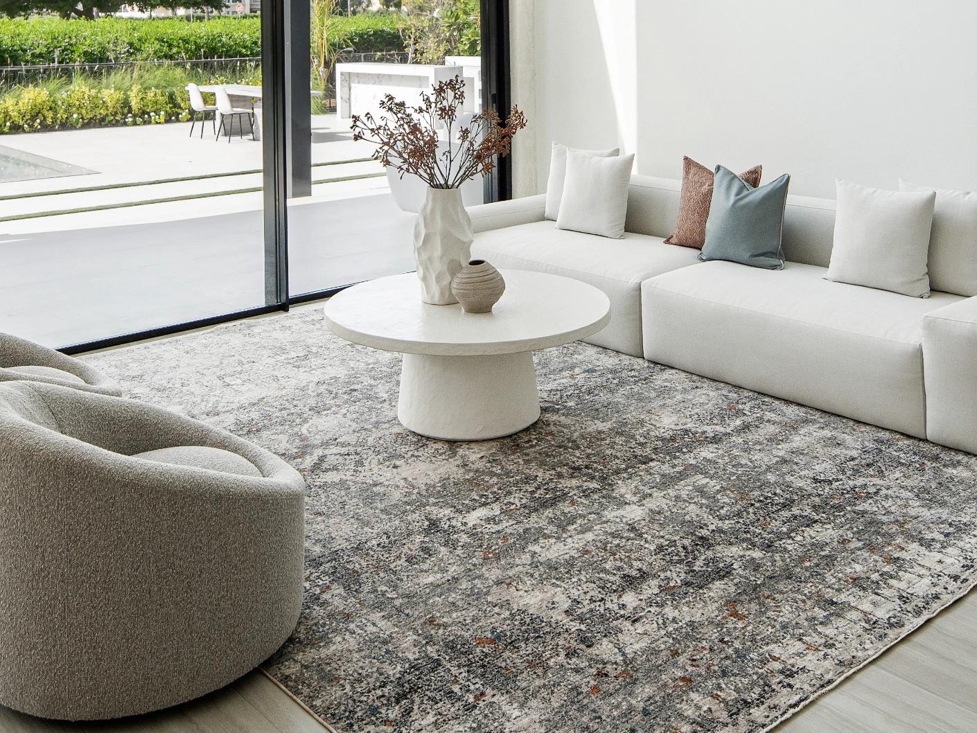 Ethan Ashton carpet in grey and beige, shown in a lifestyle front view as image 4