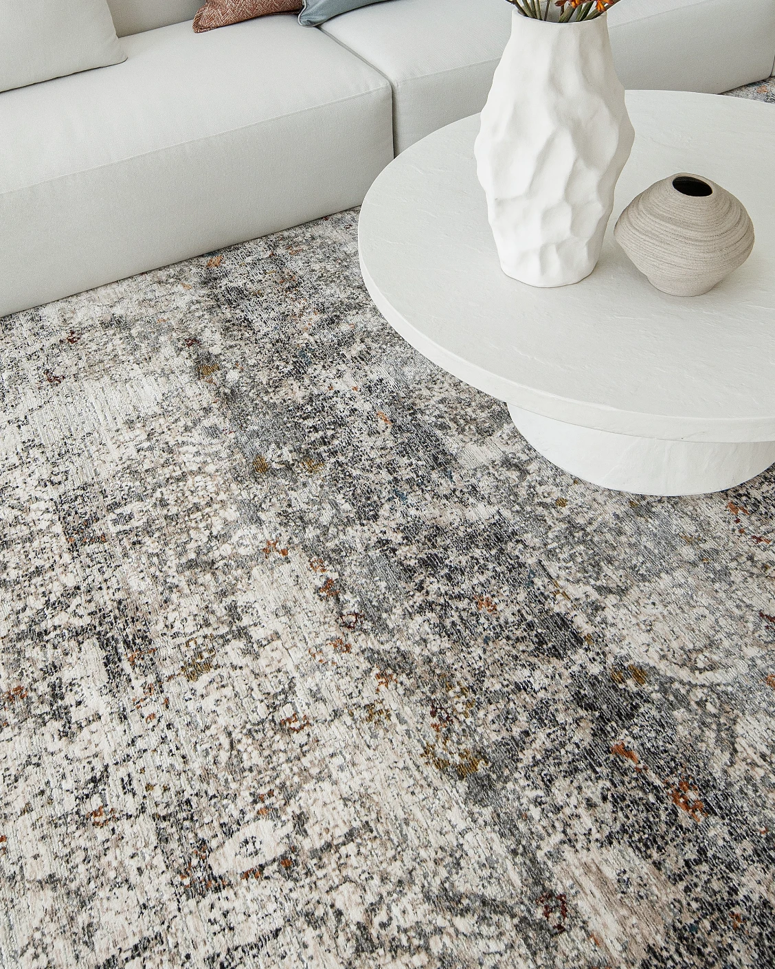 Ethan Ashton carpet in grey and beige, shown in a lifestyle top view as image 9
