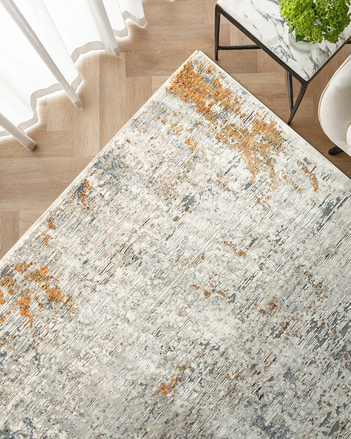 Ethan Brick carpet in gold and grey, shown in a lifestyle top view as image 2