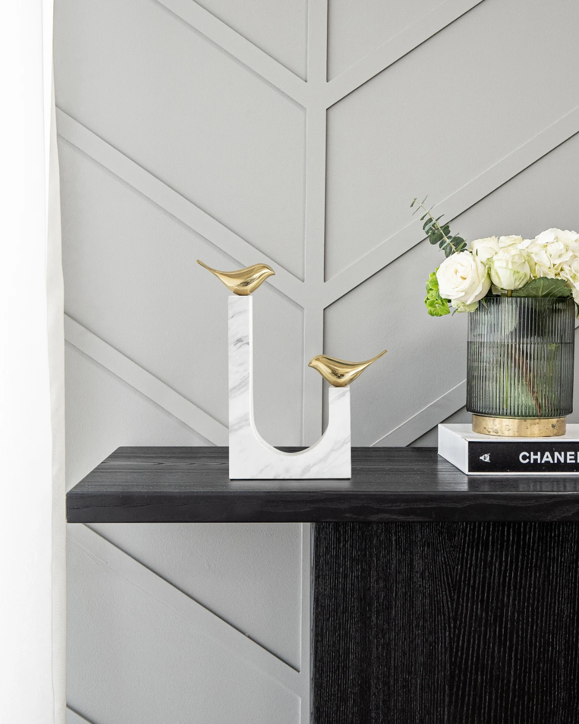 Finch Butterfield statues and sculptures in white and gold, shown in a lifestyle front view as image 2
