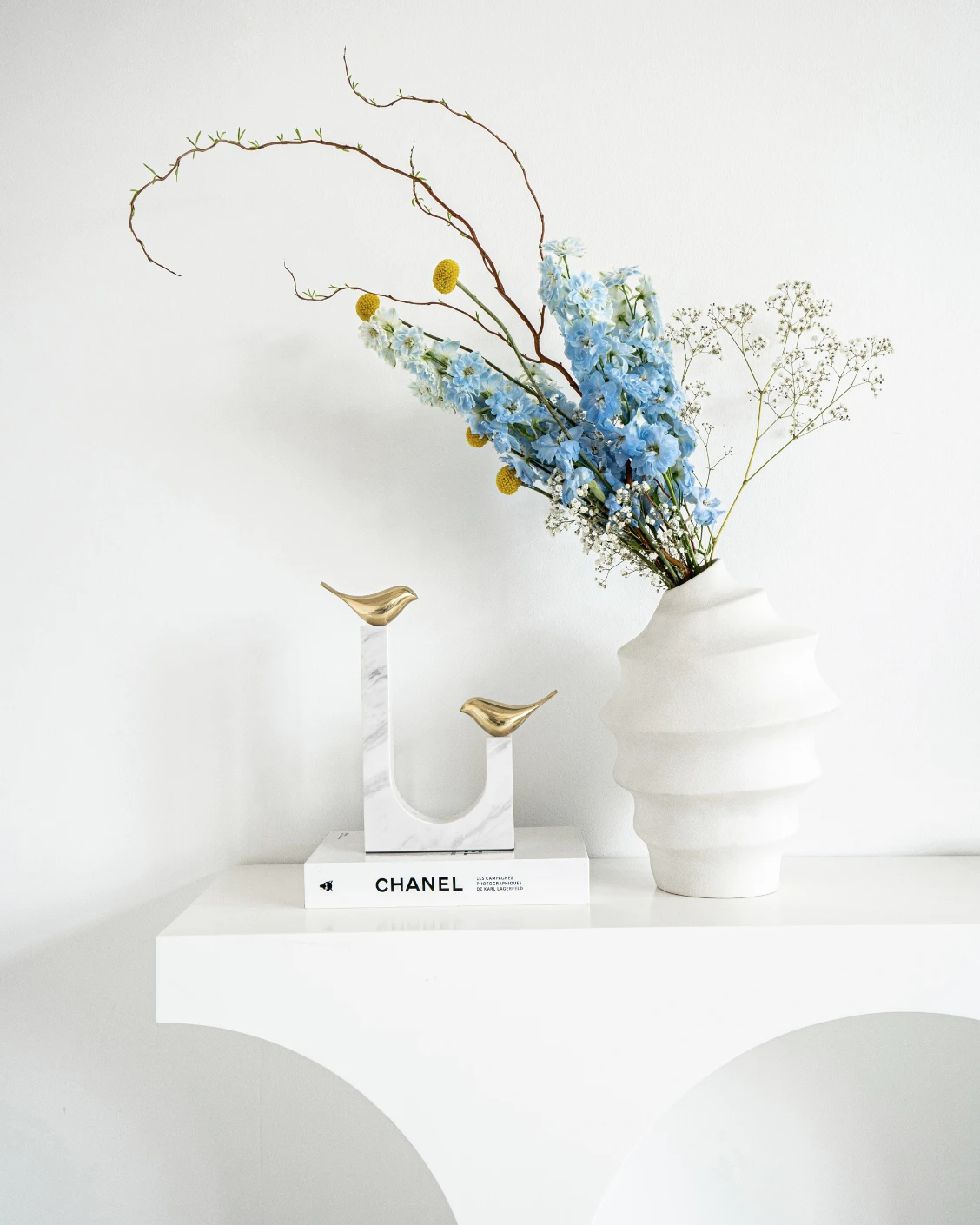 Finch Butterfield statues and sculptures in white and gold, shown in a lifestyle front view as image 3