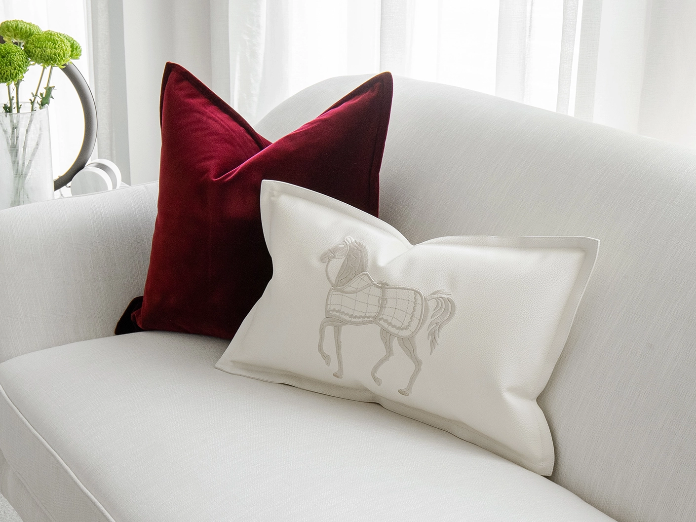 Garnet Bundle bundle cushions in red, shown in a lifestyle front view