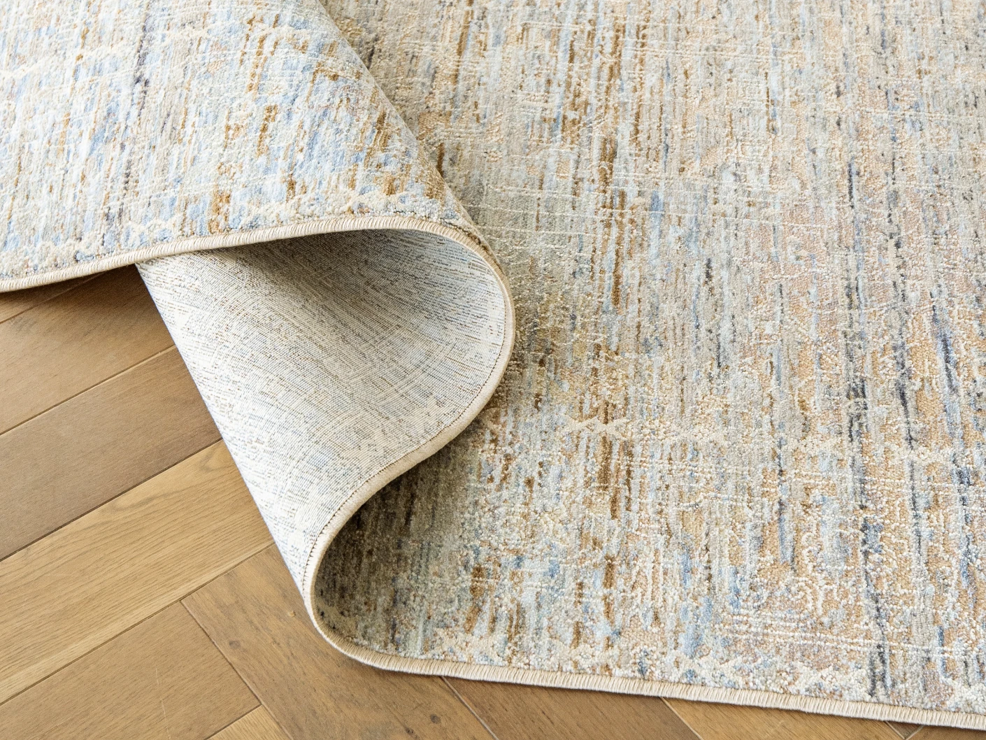 Hana Goldberg carpets in gold, shown in a lifestyle close-up view