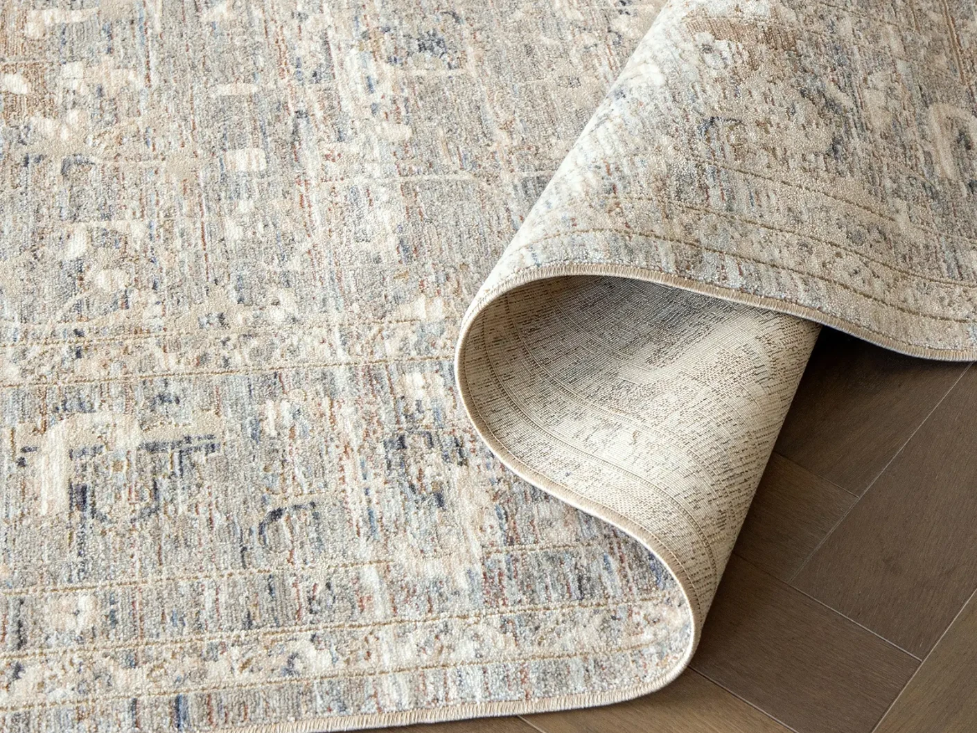 Hana Sandy carpets in sandy, beige and taupe, shown in a product close-up view