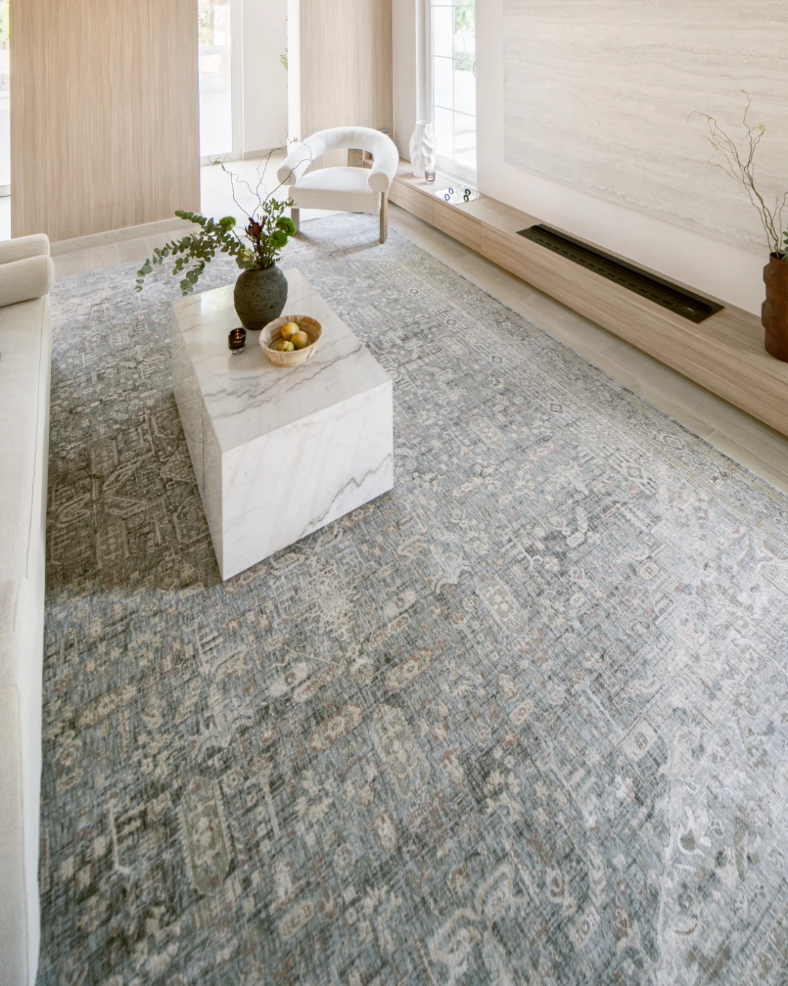 Hana Sky carpet in blue and grey, shown in a lifestyle left view as image 8