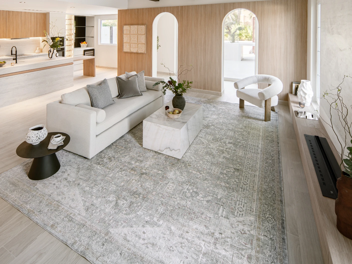 Hana Sky carpet in sky, blue and grey, shown in a lifestyle front view