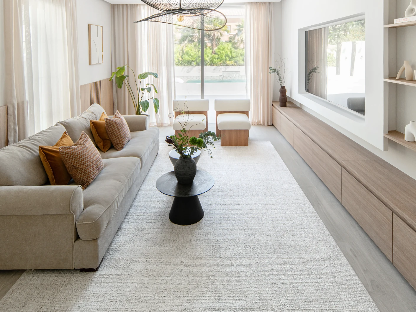 Henry Bianca carpet in ivory and pearl, shown in a lifestyle front view