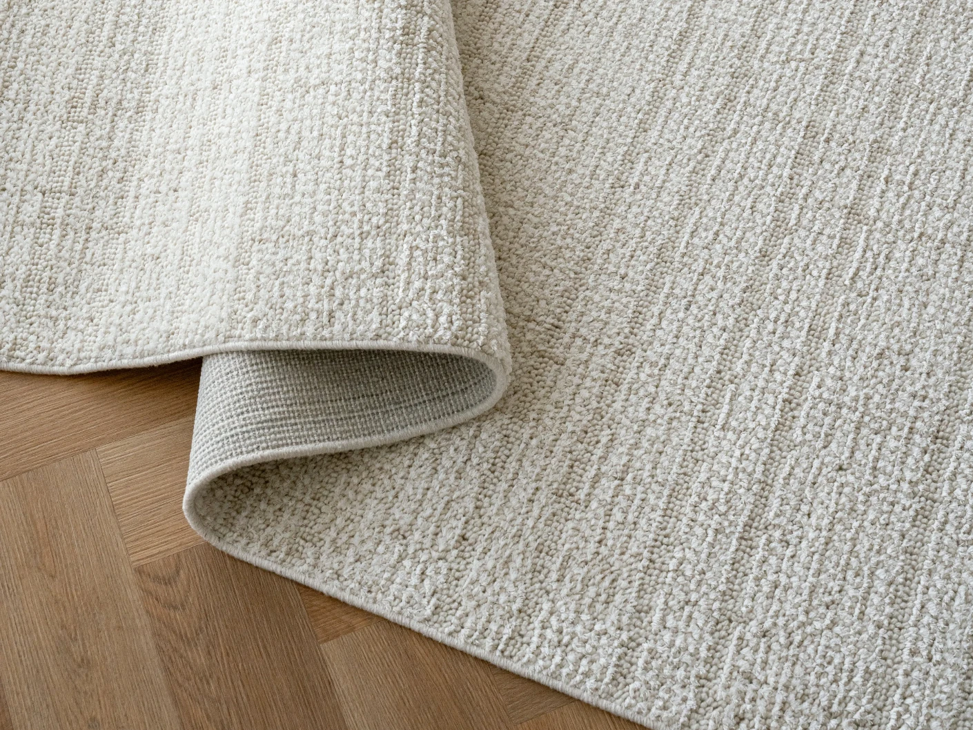 Henry Bianca carpets in ivory and pearl, shown in a product close-up view