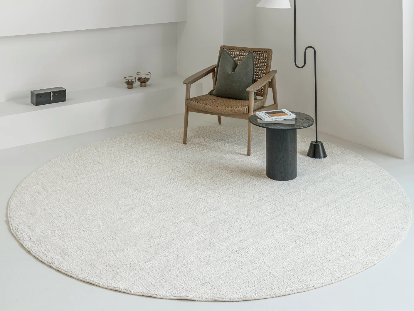 Henry Bianca Round carpet in ivory and pearl, shown in a lifestyle front view